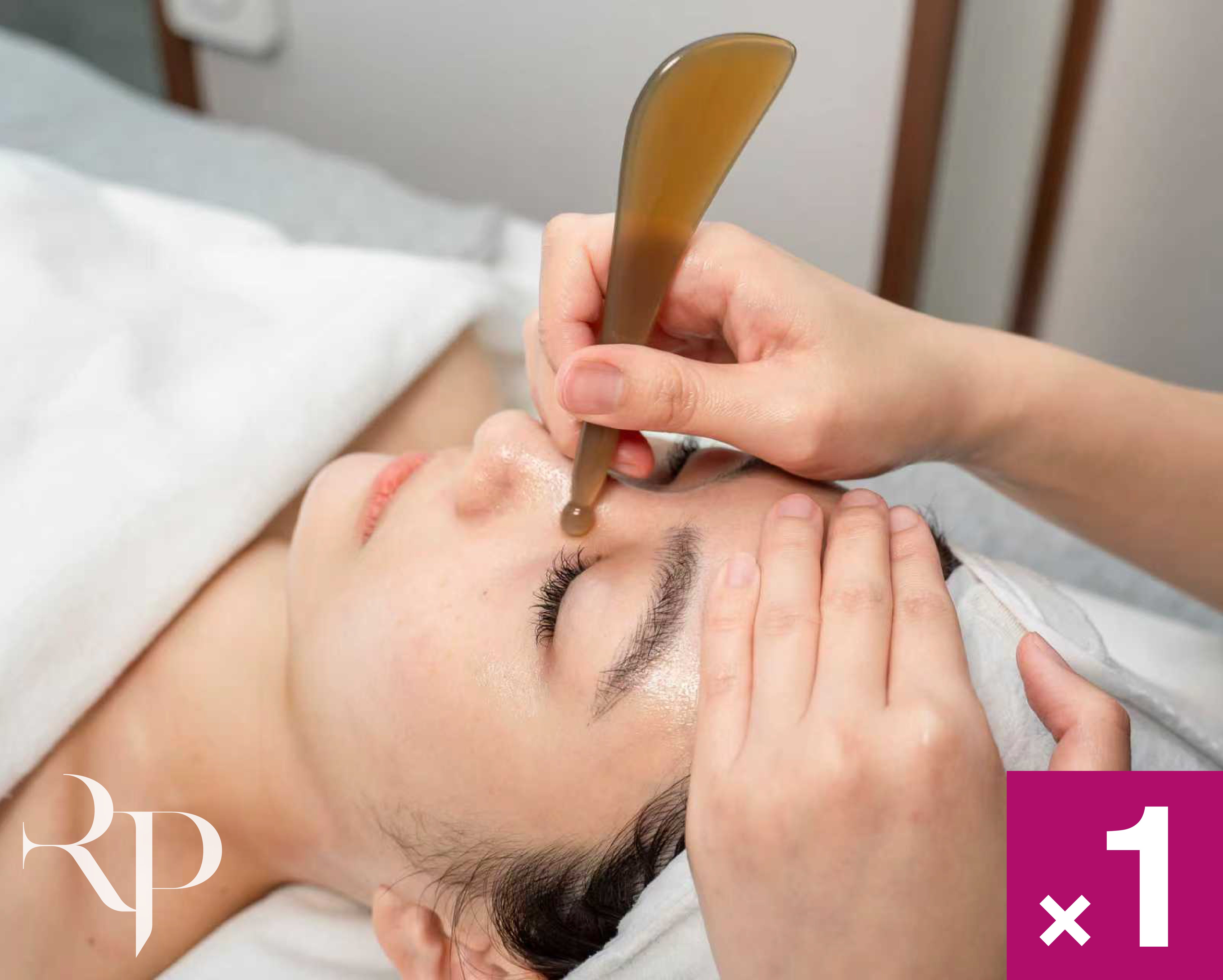 Person receiving a facial treatment with a bo-jin tool.