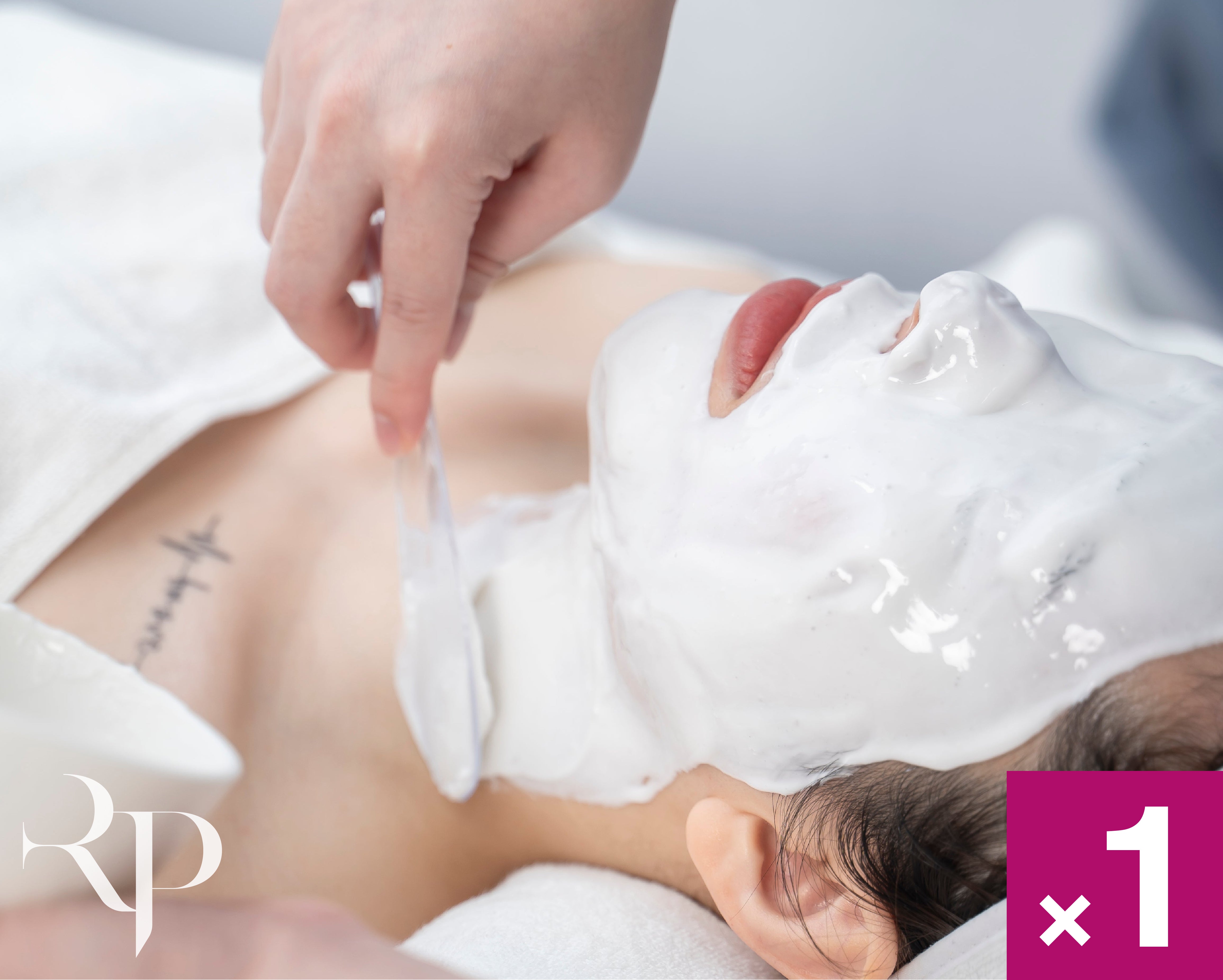 Person receiving a facial treatment with a white mask on their face, branded 'R&P'.
