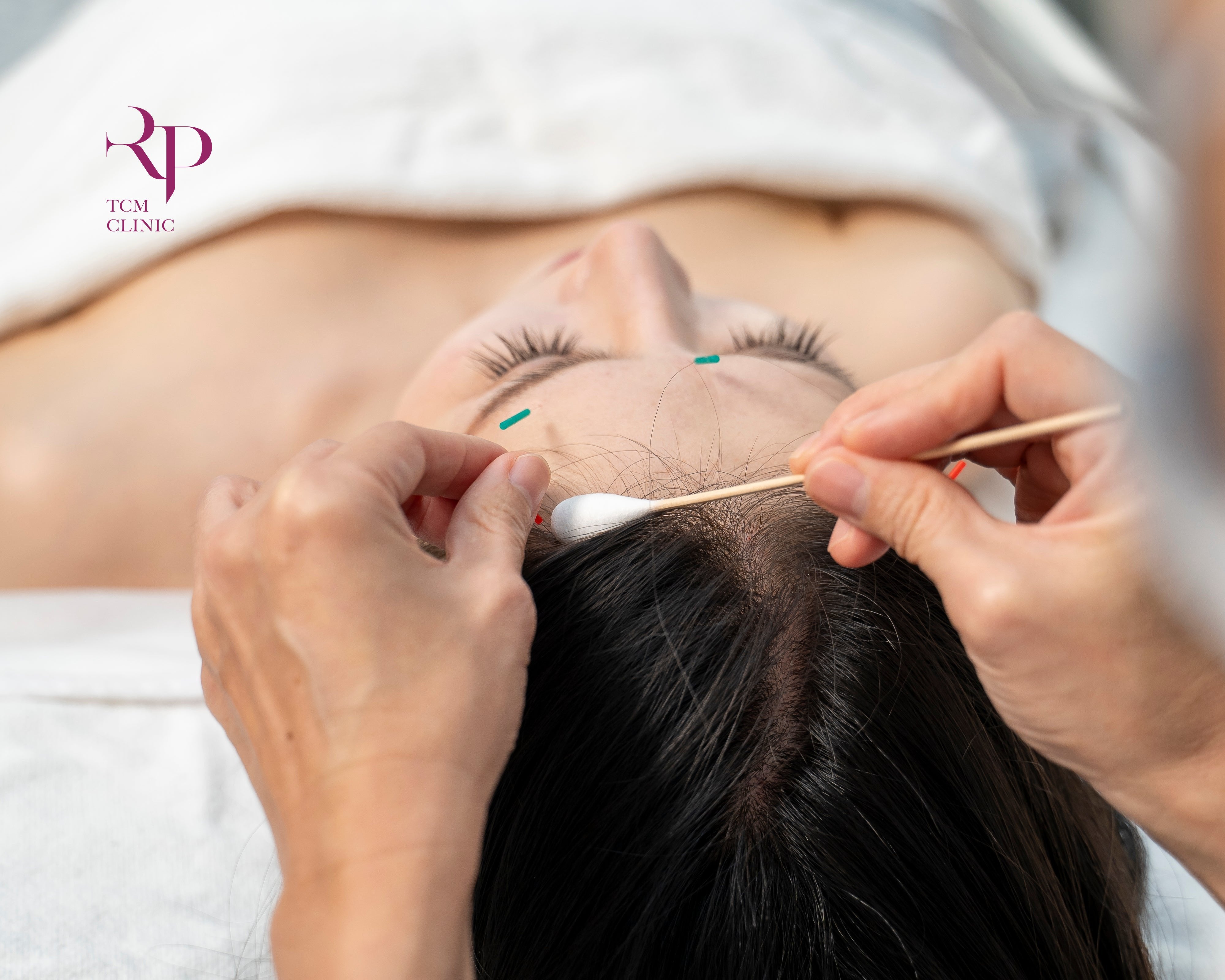 Person getting eyelash extensions at a salon